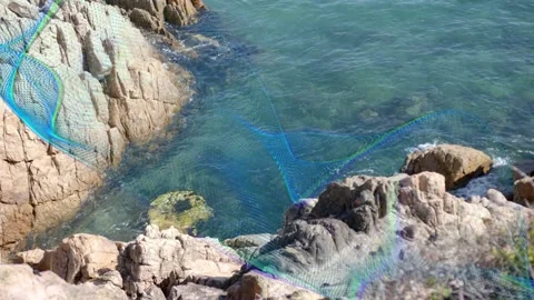 Wavy ribbon appearing frame one, sweeping over boulder, moving right, showing Stock Footage 333033748