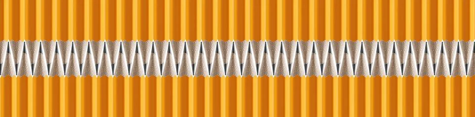 A wavy row of sharp yellow graphite pencils on an isolated white backdrop. .. Stock Photos