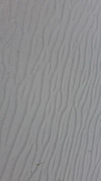 Wavy Sand Patterns on Beach Stock Photos