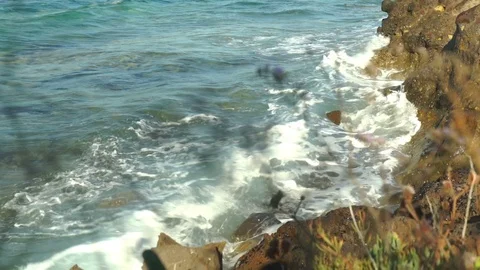 Wavy sea between rocks Stock Footage 104989053