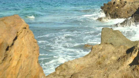 Wavy sea between rocks Stock Footage 104989571