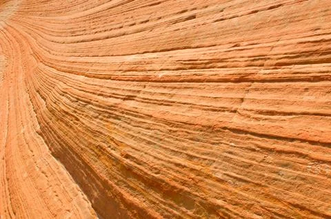 Wavy texture of red rocks Stock Photos