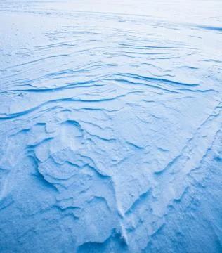 Wavy wind patterns in snow Stock Photos