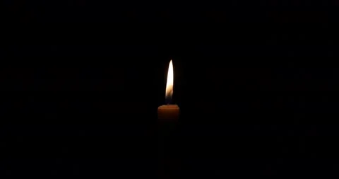 Wax candle flame light glowing without air flickering silent in the dark zoom Stock Footage 172425222