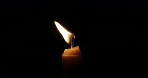 Wax candle flame light glowing jumping throbbing dancing flickering in the da Stock Footage 172425263