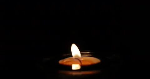 Wax candle flame light glowing without flickering silent in the dark zoom out Stock Footage 172425287