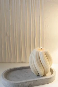 Wax candle in the interior Stock Photos