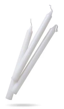 Wax candles fly close-up on a white background. Isolated Stock Photos