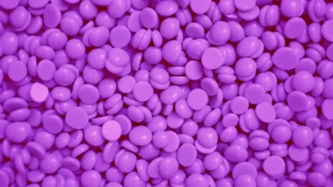Wax granules for depilation. Background wax texture. Rotation. View from above. Vidéo 237016904
