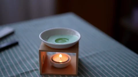 Wax melts fusing in aromatherapy lamp diffuser to provide permanent pleasant Stock Footage 265679946