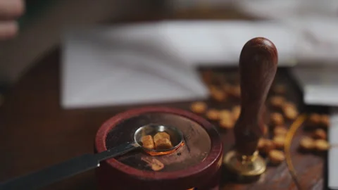 Wax seal. Preparing wedding invitations in an envelope with a wax seal. Stock Footage 117270932