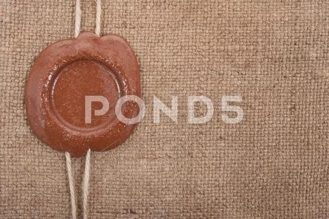 Wax seal on sackcloth material Stock Photos