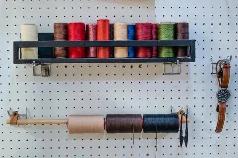 Waxed leather thread. Stock Photos