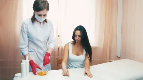 Waxing of moman's hand Stock Footage 81141588