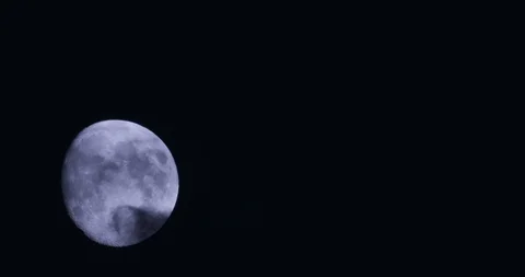Waxing moon with clouds Stock Footage 104677442