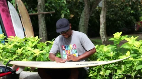 Waxing a surfboard Video stock 44400321