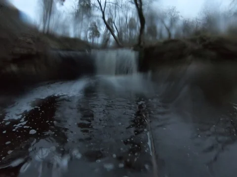 Way up to a better view of a small waterfall (drops on a lens) - 4K60 GoPro Stock Footage