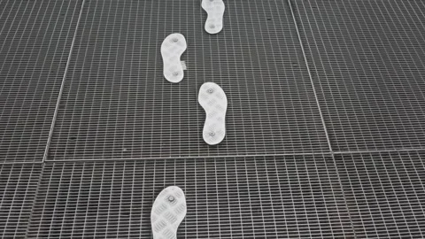 Way forward. Footsteps. Step by step. Footprints. Feet following the tracks. Ste Stock Footage 293552905