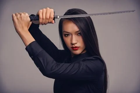 The way of the ninja. Studio portrait of a beautiful young woman in a martial Stock Photos