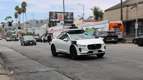 Waymo autonomous self-driving vehicle operating on a public street Stock Footage 340569490
