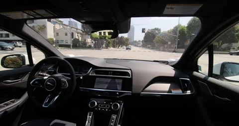 Waymo Robotaxi Makes Unprotected Left Turn Stock Footage 279353356