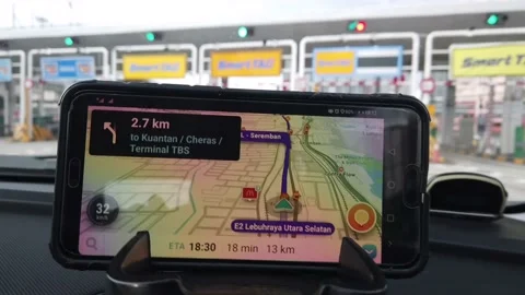 The Waze on Smartphone app on the car dashboard Stock Footage 146629136