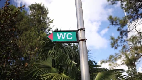 WC direction sign in park with arrow Stock Footage 331199848