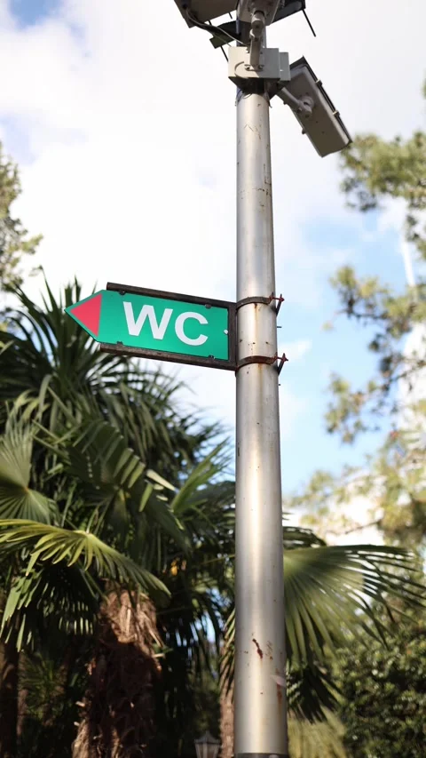 WC direction sign in park Stock Footage 331023783