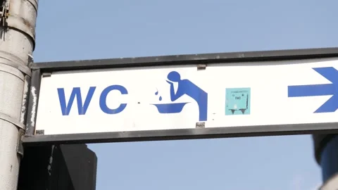 WC street pointer in Wroclaw city center in Poland - lavatory sign arrow Stock Footage 152814220