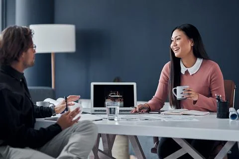 We always have the same ideas in mind. two young architects going over designs Foto stock