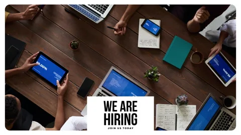 We are hiring, text animation with image of team meeting in background Stock Footage 243554545