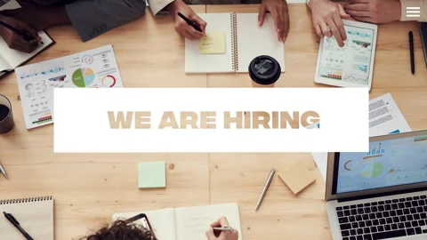 We are hiring, with working desk image in background Stock Footage 243555899