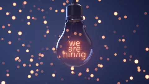 "We are hiring" written on the filament of a light bulb. Stock Footage 337102444
