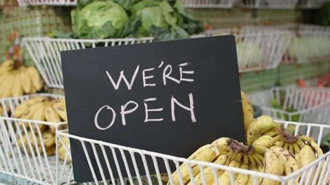 "We Are Open" Sign in Front of Fresh Produce &amp; Fruit Grocery Shop Video stock 345838285