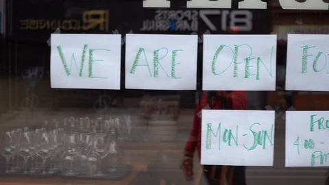 We are open for takeout sign in Toronto during COVID-19 Stock Footage 130095765