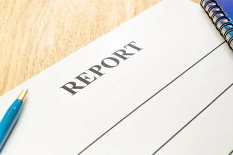 We are preparing a report - a form to fill in on a rustic table. Stock Photos