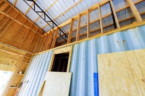 We are in process reconstructing interior of warehouse a large room is under Stock Photos