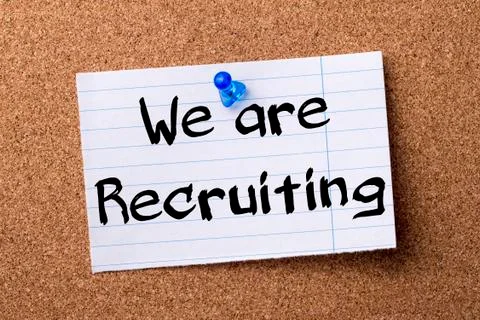 We are Recruiting - teared note paper pinned on bulletin board Stock Photos