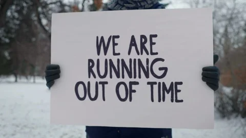 We are Running Out of Time one caucasian man Holds the Sign in the Hands Stock Footage 128002493