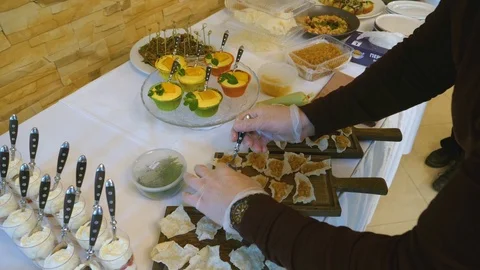 We arrange buffet snacks 01 Stock-Footage 101879826