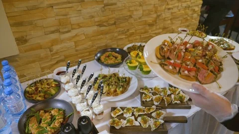 We arrange buffet snacks 02 Stock Footage 101879871