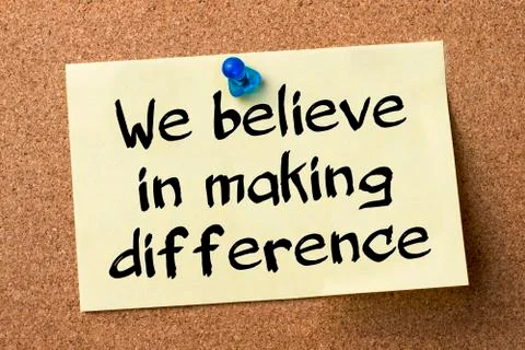 We believe in making difference - adhesive label pinned on bulletin board 写真素材