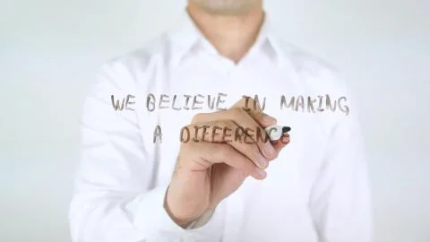 We Believe In Making A Difference, Man Writing on Glass 写真素材