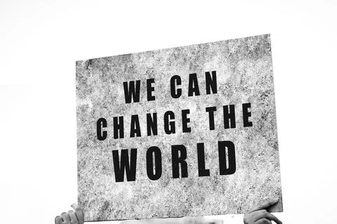 We can change the world. Hand of a protester holding a banner calling for gen Stock-Illustration