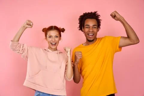 We can do it. Successful multicultural team of coworkers clench fists, celebrate Fotos de archivo