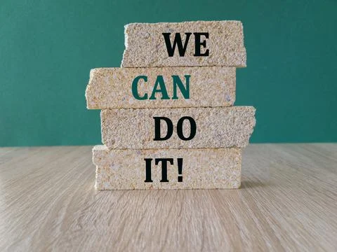We can do it symbol. Concept words We can do it on brick blocks. Stock Photos