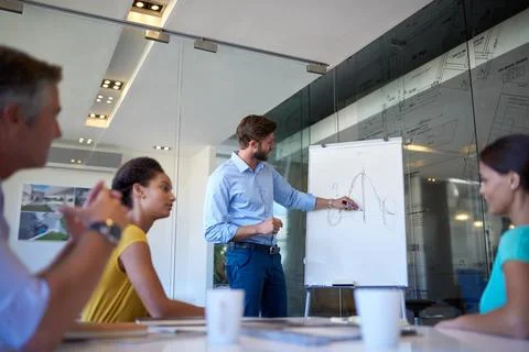 We can increase growth exponentially. a handsome young man giving a business Stock Photos