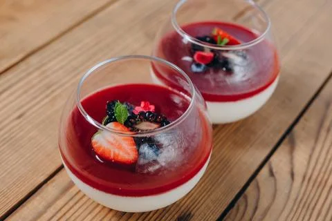We can see two cups of drink on the brown table in the restaurant. Foto stock