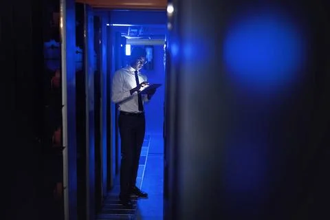 We cant allow any security threats to get through. a young man using a digital 写真素材