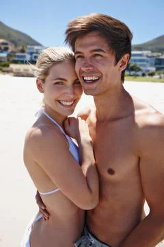 We cant keep our hands off each other. Portrait of a happy young couple enjoying Fotos de archivo